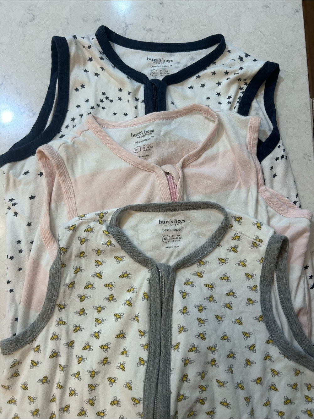 3 Burt's Bees Baby Sleeveless Sleep Sacks in various adorable prints